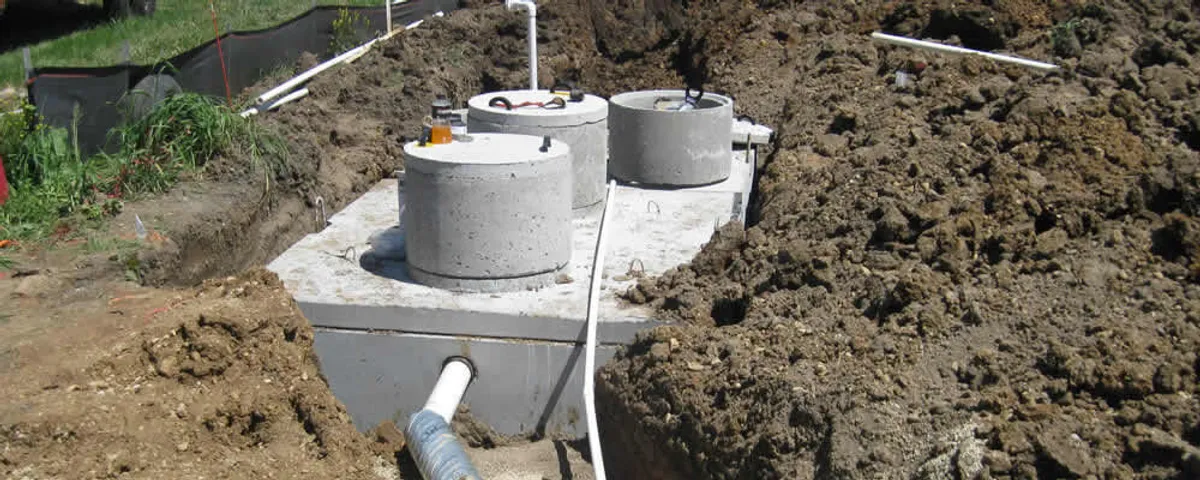 Septic system repair and installation site with tank access ports in Concord, MA